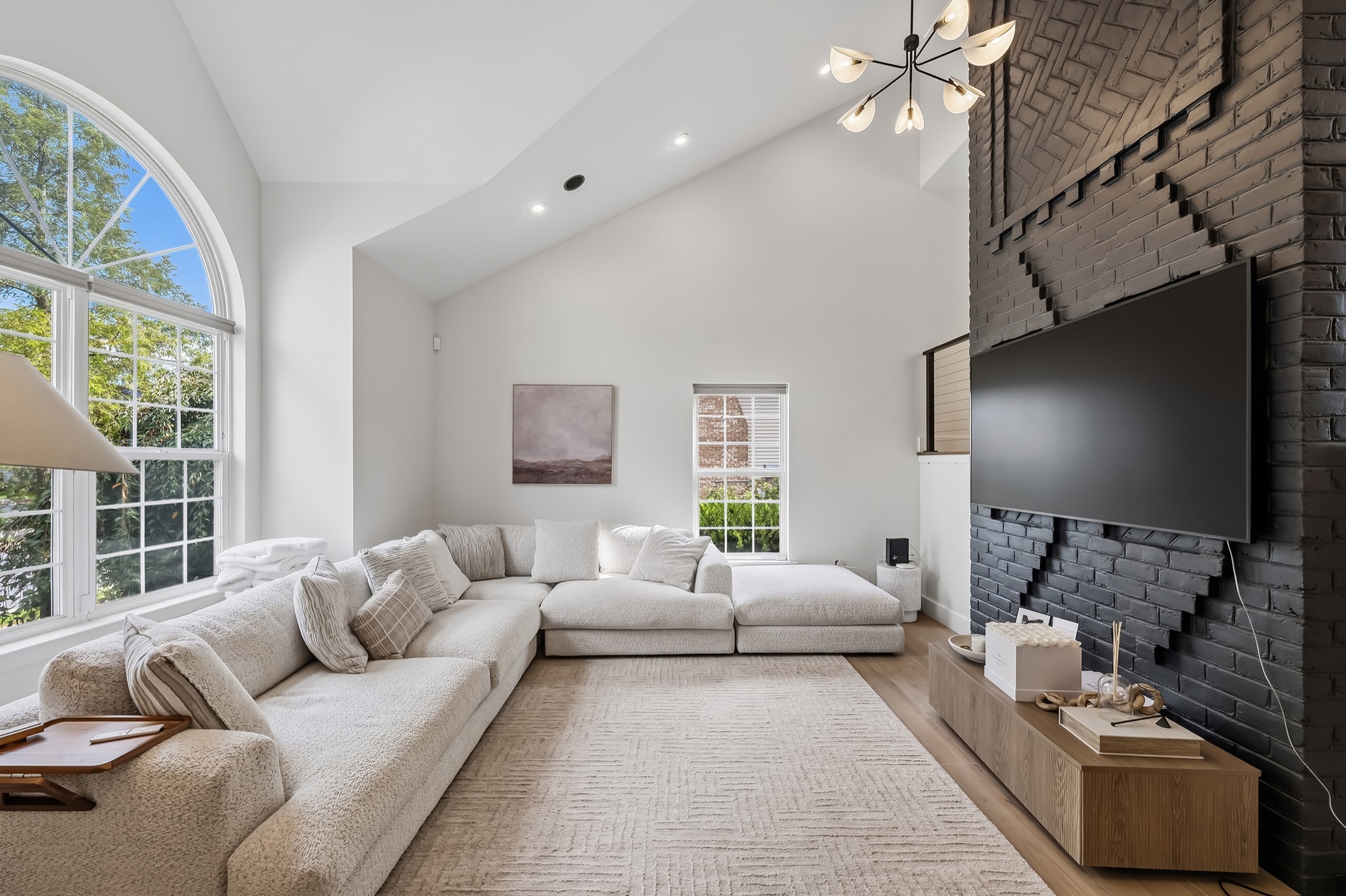 Polished living room photographed to show its light, scale and finishes